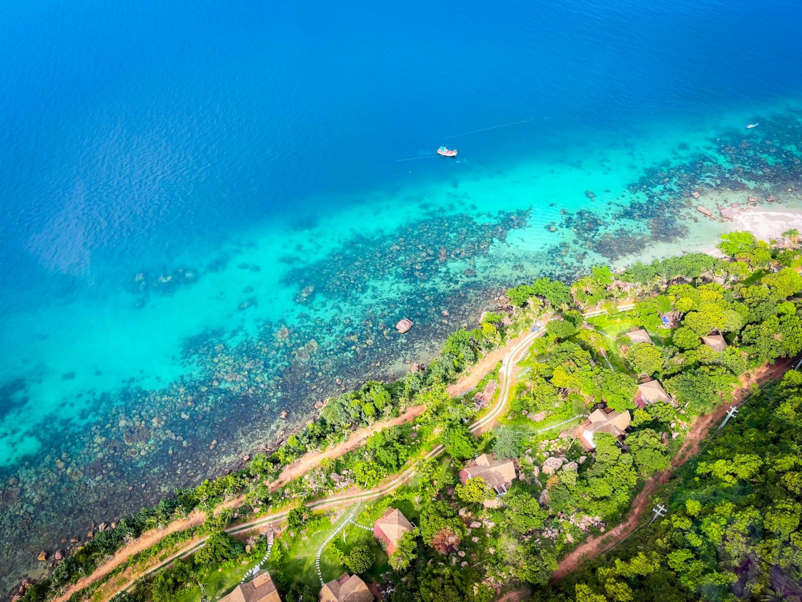 Aerial view by the blue sea in Phu Quoc Island, Vietnam (Photo by Unsplash)